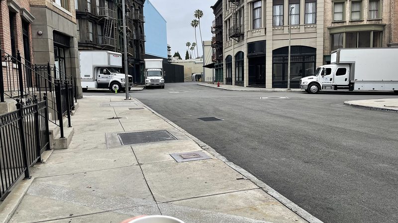 A film studio backlot street with production buildings