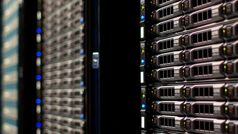 Server racks in a data center — Surge AI's ~$1.4B revenue funds the business, not a disclosed salary