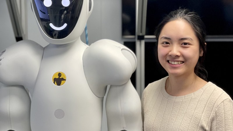 Engineer working with a collaborative humanoid robot — the physical AI workforce Figure is building