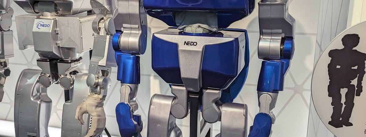 Humanoid robot exhibit representing Figure AI, the company behind Brett Adcock's fortune