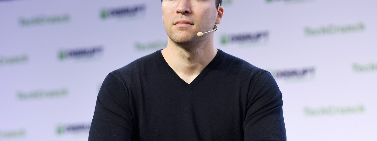 Greg Brockman speaking onstage at a 2019 technology conference