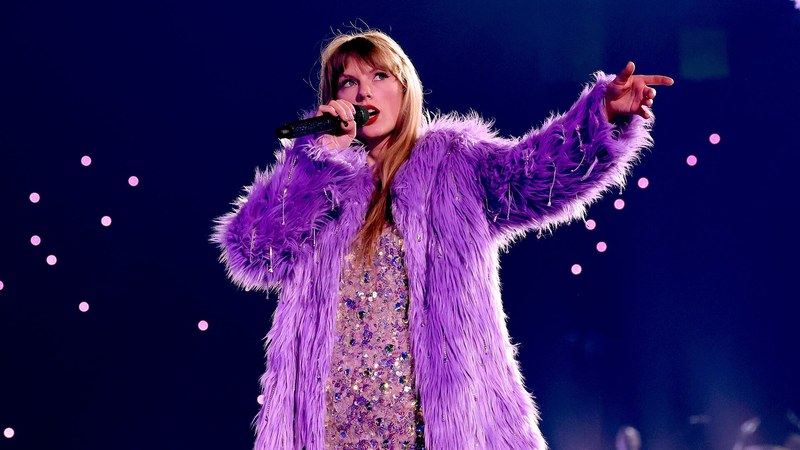 Taylor Swift performing on the Eras Tour in concert