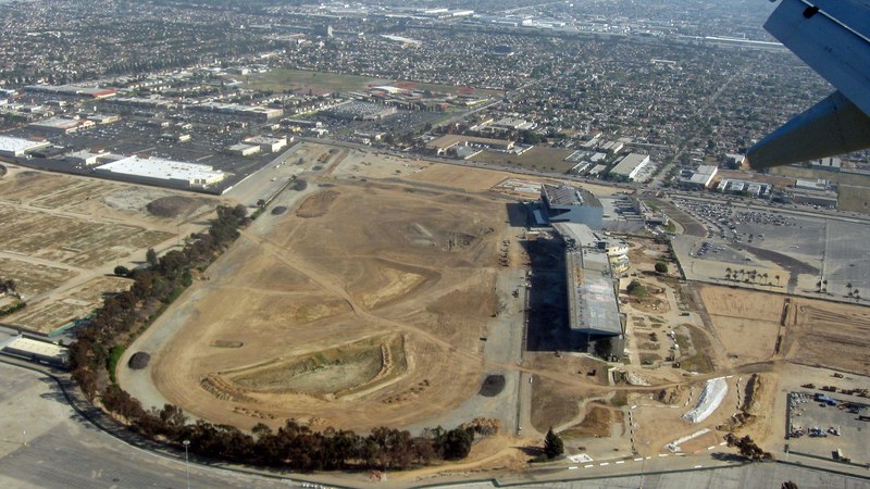 Aerial view of the SoFi Stadium construction site — the stadium deal was signed under Cagney; the venue opened under Noto