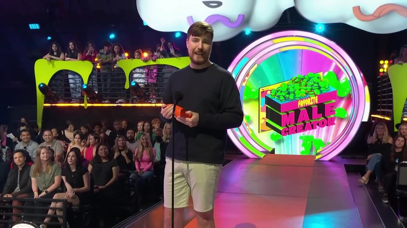 MrBeast on stage — he reinvests nearly everything he earns into bigger videos