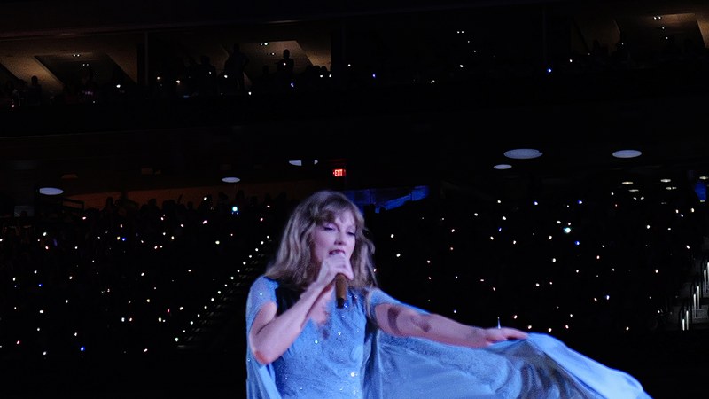 Taylor Swift performing on stage during the Eras Tour