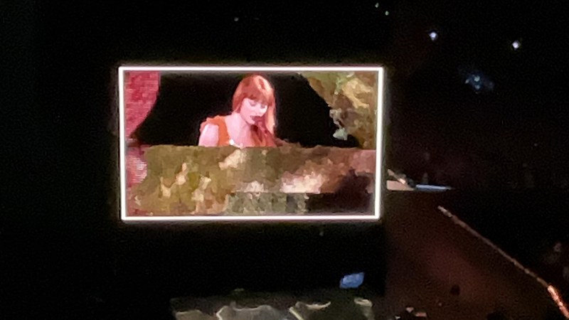 Taylor Swift performing the Evermore set during the Eras Tour